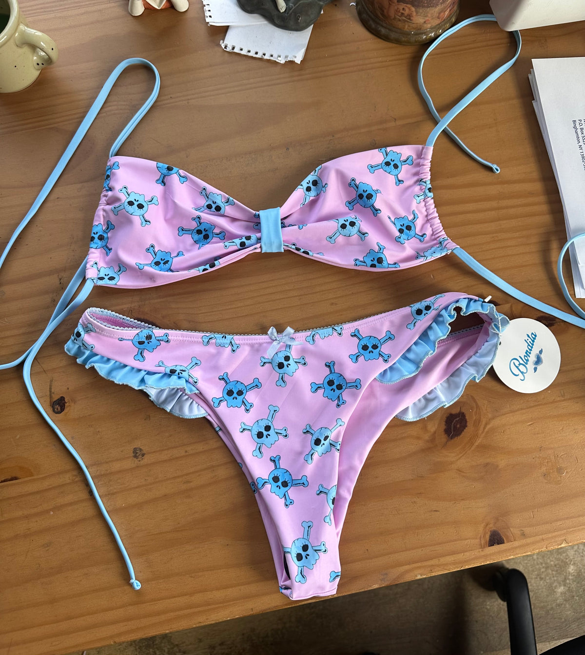  pink bikini bottom with blue skull pattern  and bow on bottom
