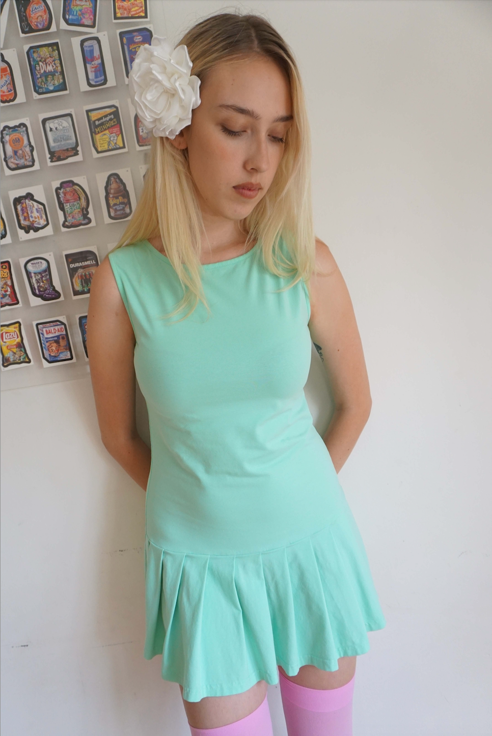 girl wearing a mint green drop waist pleated dress