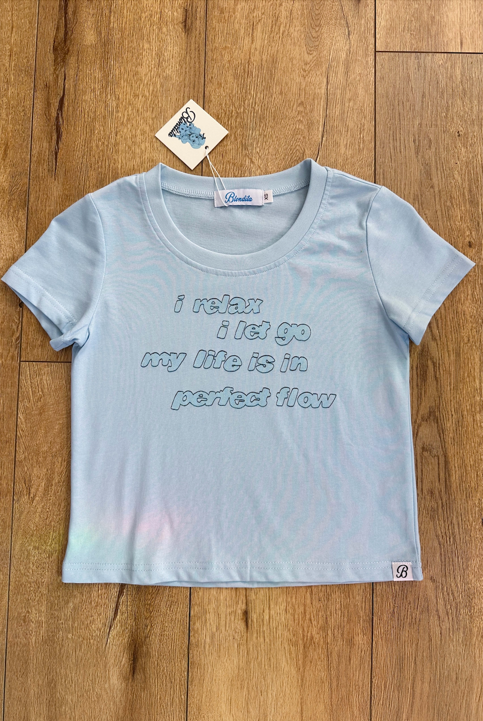 Relax Let Go Baby Tee